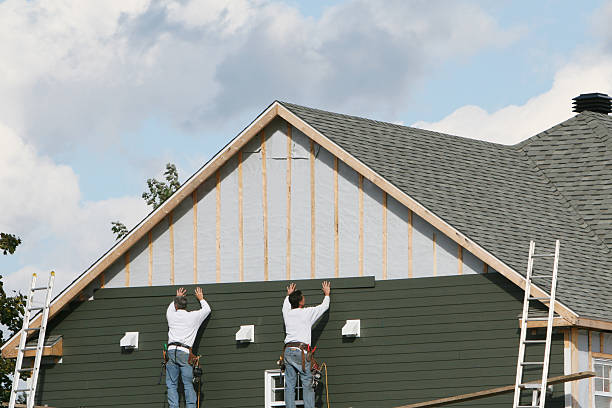 Professional Siding Contractor technician working in Woodstock, MD